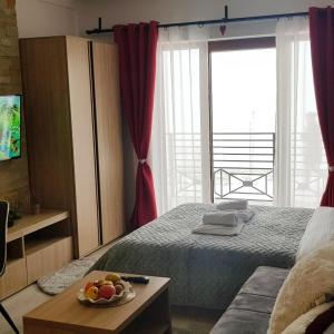 Кровать или кровати в номере Milmari Resort Maša S6