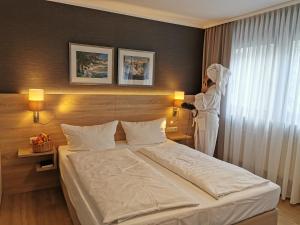Postel nebo postele na pokoji v ubytování Hotel Cristal