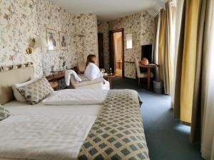 Postel nebo postele na pokoji v ubytování Hotel Cristal