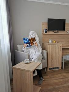 TV a/nebo společenská místnost v ubytování Hotel Cristal