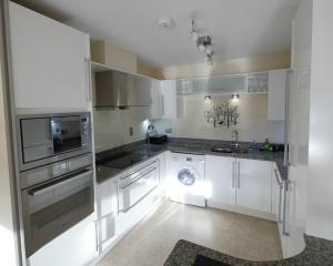Virtuve vai virtuves zona naktsmītnē Luxury riverside apartment in Kendal