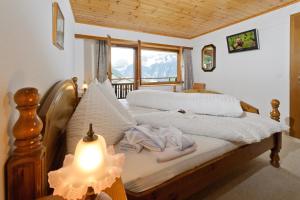 Postel nebo postele na pokoji v ubytování Touring Galerie
