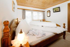 Postel nebo postele na pokoji v ubytování Touring Galerie