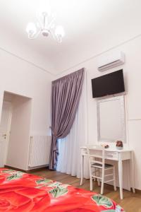 TV a/nebo společenská místnost v ubytování Palazzo Le Travi