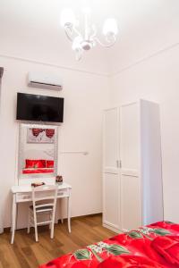 TV a/nebo společenská místnost v ubytování Palazzo Le Travi