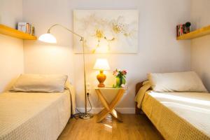 Ein Bett oder Betten in einem Zimmer der Unterkunft Blue House Rosalias