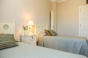 Ein Bett oder Betten in einem Zimmer der Unterkunft Blue House Rosalias