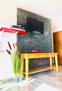 A television and/or entertainment centre at Central Studio with Lake View | 102