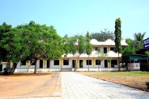 a building with a street in front of it at Rani Residency in Puducherry