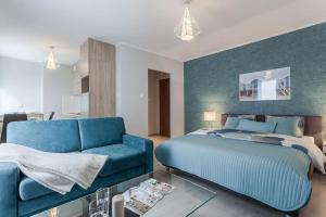 Łóżko lub łóżka w pokoju w obiekcie AbsyntApartments 24 Rynek Wrocław
