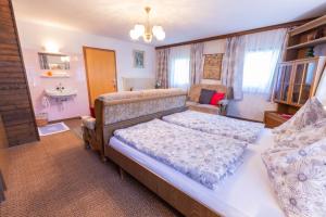 Postel nebo postele na pokoji v ubytování Haus Unterdorf