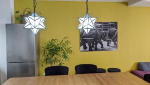 a dining room with a table with stars on the wall at roundabout OSAKA in Osaka