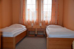 Letto o letti in una camera di Penzion YORK