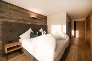 Postel nebo postele na pokoji v ubytování Hotel Stubai