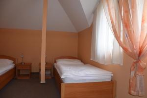 Letto o letti in una camera di Penzion YORK