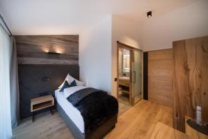 Postel nebo postele na pokoji v ubytování Hotel Stubai