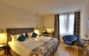 Postel nebo postele na pokoji v ubytování Nells Park Hotel