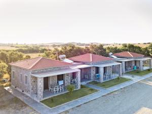 an overhead view of a house with tables and chairs at Villa Saravari in Áyios Aléxandros