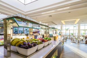 a buffet line with fruits and vegetables in a restaurant at Royal Palm Resort & Spa - Adults Only in Playa Jandia