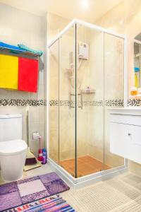 a bathroom with a shower and a toilet at The Nai Thon Condominium Unit in Nai Thon Beach