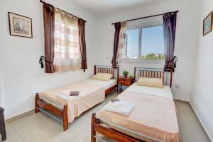 Postel nebo postele na pokoji v ubytování Anasta villa + 48 fotografií