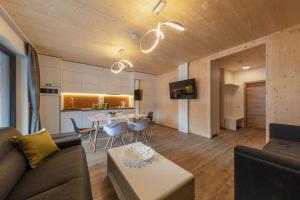 a living room with a couch and a table at ARTMUR Apartment in Sankt Georgen ob Murau
