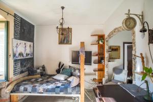 a bedroom with a bed and a clock on the wall at Nomi Dream Box in Split