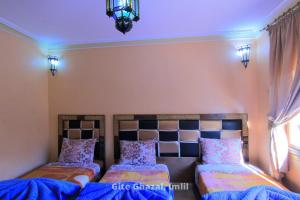 Uma cama ou camas num quarto em Chez Ghazal Imlil