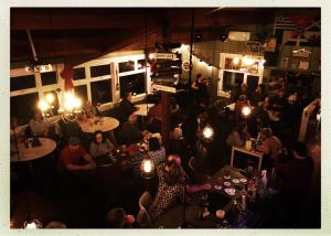 a crowd of people sitting at tables in a restaurant at The Iona Heights Inn in Iona