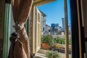 a window with a view of a city at Nomi Dream Box in Split