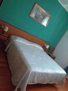Postel nebo postele na pokoji v ubytování Hotel Turano