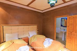 Uma cama ou camas num quarto em Chez Ghazal Imlil