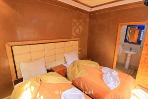Uma cama ou camas num quarto em Chez Ghazal Imlil