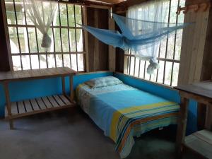 Postel nebo postele na pokoji v ubytování Ecohotel Arte y Aventura