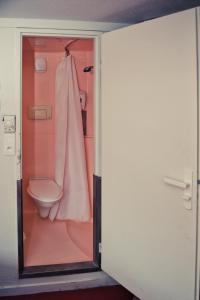 a bathroom with a toilet and a shower at Premiere Classe Beauvais in Beauvais