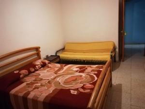 a room with two beds in a room at Habitaciones Javi Los Abrigos in Golf del Sur