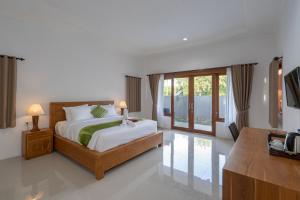 Postel nebo postele na pokoji v ubytování Nusa Indah Onai Hotel + 37 fotografií