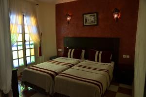 Voodi või voodid majutusasutuse Hotel Cap Sim toas