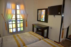 Voodi või voodid majutusasutuse Hotel Cap Sim toas
