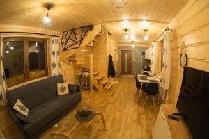 a living room and dining room in a tiny house at Domki pod Skocznią in Zakopane
