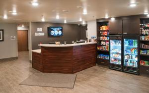 a grocery store with a counter and a refrigerator at My Place Hotel-Phoenix West/Avondale, AZ in Avondale