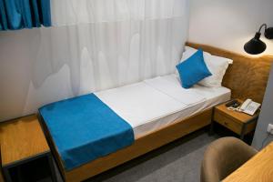 Letto o letti in una camera di R&R Hotel