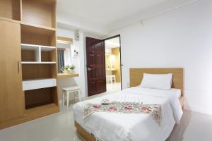 Ένα ή περισσότερα κρεβάτια σε δωμάτιο στο Beerapan Hotel