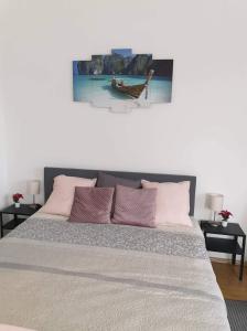 A bed or beds in a room at Relax Apartman Veresegyház