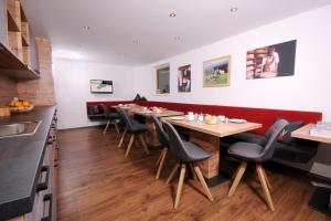 a dining room with a table and chairs at Freihaushof in Mayrhofen