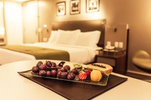 a tray of food on a table in a hotel room at Quality Porto Alegre in Porto Alegre