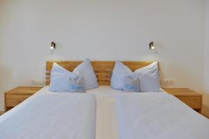 Posteľ alebo postele v izbe v ubytovaní Pension Haus Romy