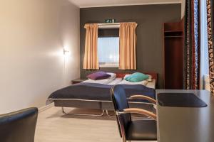 Postel nebo postele na pokoji v ubytování Melbu Hotell