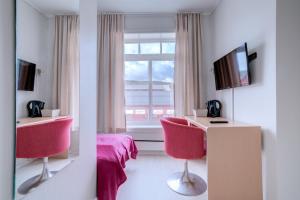TV a/nebo společenská místnost v ubytování Melbu Hotell