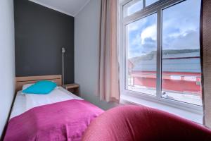 Postel nebo postele na pokoji v ubytování Melbu Hotell